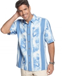 Elevate your casual style with this luxurious silk shirt from Tommy Bahama with a tropical floral print. Elevate your casual style with this luxurious silk shirt from Tommy Bahama with a tropical floral print.