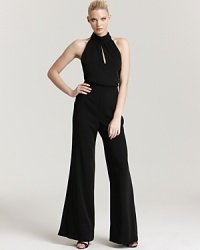 ABS by Allen Schwartz reinvents after-dark elegance with this ultra-sleek halter jumpsuit. ABS by Allen Schwartz reinvents after-dark elegance with this ultra-sleek halter jumpsuit.