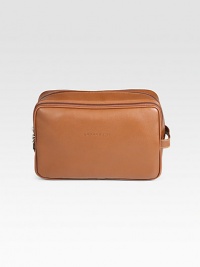 Whether you're traveling near or far, keep all of your essentials neatly packed in this suitcase essential.Zip closureSide handleFully linedLeather11W x 7H x 5DImported Whether you're traveling near or far, keep all of your essentials neatly packed in this suitcase essential.Zip closureSide handleFully linedLeather11W x 7H x 5DImported