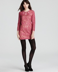 Demure yet dramatic, this Juicy Couture dress makes a statement as a metallic underlay shimmers beneath a sheer lace overlay. Cutouts at the neckline up the glamour factor. Demure yet dramatic, this Juicy Couture dress makes a statement as a metallic underlay shimmers beneath a sheer lace overlay. Cutouts at the neckline up the glamour factor.