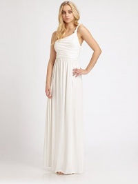 This breathtaking, goddess-inspired gown with a single tie-knot detail is crafted with soft stretch fabric for superior comfort. One knotted shoulder strapShirred bodiceEmpire waistFull, shirred skirtAbout 62 from shoulder to hem92% modal/8% spandexDry cleanMade in USAModel shown is 5'9 (176cm) wearing US size Small. This breathtaking, goddess-inspired gown with a single tie-knot detail is crafted with soft stretch fabric for superior comfort. One knotted shoulder strapShirred bodiceEmpire waistFull, shirred skirtAbout 62 from shoulder to hem92% modal/8% spandexDry cleanMade in USAModel shown is 5'9 (176cm) wearing US size Small.