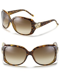 Shield your eyes in style. These classically elegant Gucci frames get an infusion of girly glamour thanks to double G heart logos at temples. Shield your eyes in style. These classically elegant Gucci frames get an infusion of girly glamour thanks to double G heart logos at temples.
