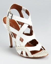 Topstitched details in varying widths add textural appeal to Boutique 9's Dafnee sandals, finished with snakeskin embossed trim for an exotic touch. Topstitched details in varying widths add textural appeal to Boutique 9's Dafnee sandals, finished with snakeskin embossed trim for an exotic touch.