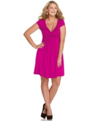Ruching and gathering lend an ultra-flattering silhouette to the short sleeve plus size dress by Soprano-- it's a must-have! Ruching and gathering lend an ultra-flattering silhouette to the short sleeve plus size dress by Soprano-- it's a must-have!