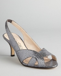 Sparkle in these glittery Caparros sandals; a wearable heel lets you dance the night away without kicking them off. Sparkle in these glittery Caparros sandals; a wearable heel lets you dance the night away without kicking them off.