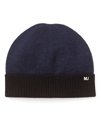 Color block pops on top with this critical component to your cold weather wardrobe, embellished with a logo on the cuffed bottom. Color block pops on top with this critical component to your cold weather wardrobe, embellished with a logo on the cuffed bottom.