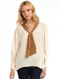 THE LOOKColorblock designPullover styleTie neckLong dolman sleeves with button cuffsPleated shouldersSide seam pocketsBack gusset pleatTHE FITAbout 27 from shoulder to hemTHE MATERIALSilkCARE & ORIGINDry cleanImportedModel shown is 5'10 (177cm) wearing US size Small. THE LOOKColorblock designPullover styleTie neckLong dolman sleeves with button cuffsPleated shouldersSide seam pocketsBack gusset pleatTHE FITAbout 27 from shoulder to hemTHE MATERIALSilkCARE & ORIGINDry cleanImportedModel shown is 5'10 (177cm) wearing US size Small.