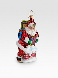 A traditional glass ornament shows Santa and gifts sneaking down the chimney.Hand-blownHand-painted6.5 tallMade in Poland A traditional glass ornament shows Santa and gifts sneaking down the chimney.Hand-blownHand-painted6.5 tallMade in Poland