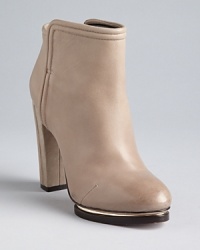 Bold, metal-accented, sculpted platforms give these Rachel Roy booties edge. Bold, metal-accented, sculpted platforms give these Rachel Roy booties edge.