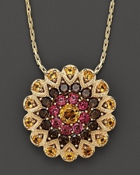 A glittering burst of 14K yellow gold, set with citrine, smokey quartz and garnet. A glittering burst of 14K yellow gold, set with citrine, smokey quartz and garnet.