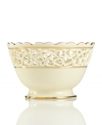 Distinguished by a scalloped edge, bands of gold and heart cutouts in creamy ivory porcelain, this lovely bowl combines traditional style and timeless grace. Distinguished by a scalloped edge, bands of gold and heart cutouts in creamy ivory porcelain, this lovely bowl combines traditional style and timeless grace.