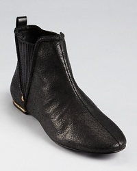 In crackled leather, these low-key Juicy Couture booties lend a toughened-up bohemian look--cute at Coachella with a cotton sun dress. In crackled leather, these low-key Juicy Couture booties lend a toughened-up bohemian look--cute at Coachella with a cotton sun dress.