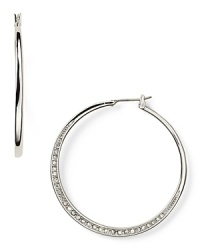 Michael Kors' pavé -encrusted hoops are a versatile daytime detail. Pay attention to the finer points and wear these to add polish to sharp tailoring and sleek suiting.
