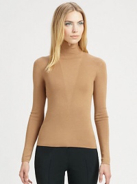 A luxurious cashmere/silk blend, knit with an architectural, notched mock neck.Notched mock neckFront V detailLong sleeves70% cashmere/30% silkDry cleanMade in SwitzerlandModel shown is 5'11 (180cm) wearing US size 4. A luxurious cashmere/silk blend, knit with an architectural, notched mock neck.Notched mock neckFront V detailLong sleeves70% cashmere/30% silkDry cleanMade in SwitzerlandModel shown is 5'11 (180cm) wearing US size 4.