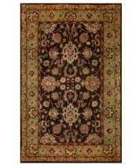 Drawing inspiration from the sandy ruins of ancient Petra and the traditional designs of India, this elegant, hand-tufted rug presents a rich decorative history set against an earthy backdrop and accented with multiple gold and plum tones. Drawing inspiration from the sandy ruins of ancient Petra and the traditional designs of India, this elegant, hand-tufted rug presents a rich decorative history set against an earthy backdrop and accented with multiple gold and plum tones.
