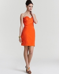 This Jay Godfrey strapless dress looks on the bright side with a statement-making neon hue. This Jay Godfrey strapless dress looks on the bright side with a statement-making neon hue.