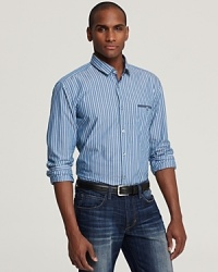 An upbeat sport shirt tailored for a modern slim fit with downtown appeal adds a dose of color to your look. An upbeat sport shirt tailored for a modern slim fit with downtown appeal adds a dose of color to your look.