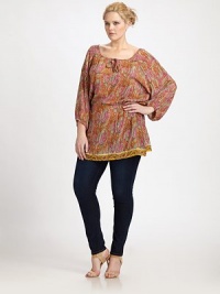 Undeniably feminine, a timeless silhouette with a self-tie neckline and a classic paisley print in soft colors that can be worn as a tunic or dress. Self-tie detail at necklineThree-quarter sleevesContrasting print trimElasticized waistAbout 14 from natural waistSilkDry cleanImported Undeniably feminine, a timeless silhouette with a self-tie neckline and a classic paisley print in soft colors that can be worn as a tunic or dress. Self-tie detail at necklineThree-quarter sleevesContrasting print trimElasticized waistAbout 14 from natural waistSilkDry cleanImported