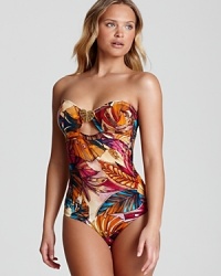 Tropical leaves overtake this strapless OndadeMar one-piece swimsuit, rendered in warm hues and a classic, flattering silhouette. Tropical leaves overtake this strapless OndadeMar one-piece swimsuit, rendered in warm hues and a classic, flattering silhouette.