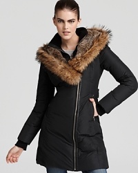 Mackage's plush down coat boasts a luxe fur ruff and fur-lined hood to ensure you keep cozy all through winter. Mackage's plush down coat boasts a luxe fur ruff and fur-lined hood to ensure you keep cozy all through winter.