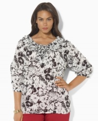 A bold floral print lends feminine appeal to this Lauren by Ralph Lauren's plus size top, designed in light-as-air cotton voile with voluminous ruffles for a graceful touch. A bold floral print lends feminine appeal to this Lauren by Ralph Lauren's plus size top, designed in light-as-air cotton voile with voluminous ruffles for a graceful touch.