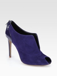 A skin-baring center slit amplifies this suede and patent leather peep toe design. Patent leather-covered heel, 4 (100mm)Suede upper with patent leather trimPeep toeBack zipLeather lining and solePadded insoleImported A skin-baring center slit amplifies this suede and patent leather peep toe design. Patent leather-covered heel, 4 (100mm)Suede upper with patent leather trimPeep toeBack zipLeather lining and solePadded insoleImported