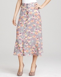 Muted hues and a painterly print impart pared-down glam to this maxi length Tucker skirt. Wear with nude platform pumps and a simple tee for a subtle nod to 1970s style.