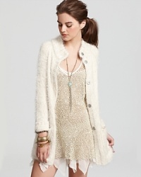 A dreamy, cream-colored Free People sweater takes the classic cardi to longer lengths for fall--cozy-chic layers are what carries us through the new season. A dreamy, cream-colored Free People sweater takes the classic cardi to longer lengths for fall--cozy-chic layers are what carries us through the new season.