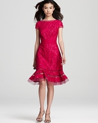 Tadashi Shoji's vibrant lace dress lends drama with a flared hem, detailed with sheer mesh stripes for a modern look. Tadashi Shoji's vibrant lace dress lends drama with a flared hem, detailed with sheer mesh stripes for a modern look.