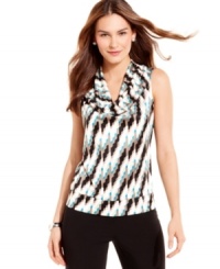 A petite cowl-neck top from Alfani gets graphic with an allover geometric print. Show off this bold style by pairing it with chic basics and subtle accessories. A petite cowl-neck top from Alfani gets graphic with an allover geometric print. Show off this bold style by pairing it with chic basics and subtle accessories.