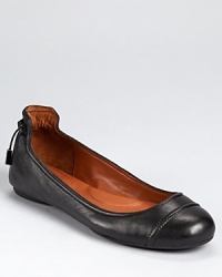 Dramatic detailing and a sweet bow elevate the classic ballet flat to stylish new heights. By Calvin Klein. Dramatic detailing and a sweet bow elevate the classic ballet flat to stylish new heights. By Calvin Klein.