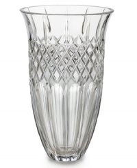 Narrow flutes and a diamond grid converge in pristine Waterford crystal, gracing the Shelton vase with old-world resplendency. A beautiful host for fresh flowers in your own home – or a memorable gift for someone you love. Shown left. Narrow flutes and a diamond grid converge in pristine Waterford crystal, gracing the Shelton vase with old-world resplendency. A beautiful host for fresh flowers in your own home – or a memorable gift for someone you love. Shown left.