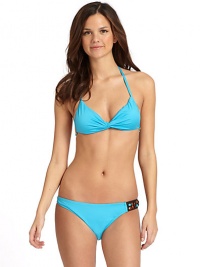THE LOOKTwisted detailing at frontHalter straps tie at neckLined soft cupsBack tie closure with bead accentsTHE MATERIAL80% nylon/20% spandexFully linedCARE & ORIGINHand washMade in USAPlease note: Bikini bottom sold separately. THE LOOKTwisted detailing at frontHalter straps tie at neckLined soft cupsBack tie closure with bead accentsTHE MATERIAL80% nylon/20% spandexFully linedCARE & ORIGINHand washMade in USAPlease note: Bikini bottom sold separately.