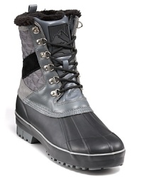 Creative Recreation's rugged all-weather boot keeps your cold weather look grounded, with molded rubber toe and side, burnished leather upper and a cozy faux-fur lining. Creative Recreation's rugged all-weather boot keeps your cold weather look grounded, with molded rubber toe and side, burnished leather upper and a cozy faux-fur lining.