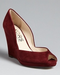 Retro refinement from KORS Michael Kors: these suede peep toe wedges look stunning with tights and fab with '70s-inspired flares. Retro refinement from KORS Michael Kors: these suede peep toe wedges look stunning with tights and fab with '70s-inspired flares.