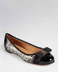 Rib textured patent leather is splashed in leopard print on Salvatore Ferragamo's Tuma flats, adorned with the brand's iconic bow at the toe. Rib textured patent leather is splashed in leopard print on Salvatore Ferragamo's Tuma flats, adorned with the brand's iconic bow at the toe.