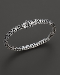 Small sterling woven chain bracelet with carved chain clasp, designed by John Hardy. Small sterling woven chain bracelet with carved chain clasp, designed by John Hardy.