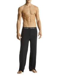 Sexy-fit with contour shapes, soft hand with luxurious drape. Exposed waistband style pajama pants. Sexy-fit with contour shapes, soft hand with luxurious drape. Exposed waistband style pajama pants.