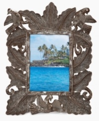 The eco-friendly and enchanting Forest picture frame surrounds images of your favorite people and places with lush and exotic Haitian foliage, all hand cut and hammered in recycled steel. Once the shaping and detail is complete, each is varnished and dried in the hot Caribbean sun. The eco-friendly and enchanting Forest picture frame surrounds images of your favorite people and places with lush and exotic Haitian foliage, all hand cut and hammered in recycled steel. Once the shaping and detail is complete, each is varnished and dried in the hot Caribbean sun.