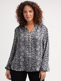 An exotic print meets lightweight fabrication to create a modern blouse with chain ties at its neckline. It will look incredible tucked into your favorite pencil skirt.Chain ties at necklineLong sleevesButton cuffsConcealed front closureAllover printBack yokeAbout 25 from shoulder to hemPolyesterHand washImported An exotic print meets lightweight fabrication to create a modern blouse with chain ties at its neckline. It will look incredible tucked into your favorite pencil skirt.Chain ties at necklineLong sleevesButton cuffsConcealed front closureAllover printBack yokeAbout 25 from shoulder to hemPolyesterHand washImported
