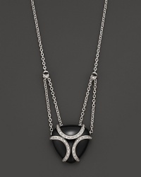 A bold sterling silver cage, glistening with diamonds, encases a gleaming black onyx stone. By Di MODOLO. A bold sterling silver cage, glistening with diamonds, encases a gleaming black onyx stone. By Di MODOLO.