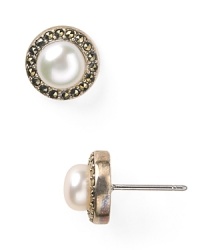Get lost in the simply styled beauty of these Judith Jack earrings, cast in sterling silver and accented by delicate pearl studs. Get lost in the simply styled beauty of these Judith Jack earrings, cast in sterling silver and accented by delicate pearl studs.