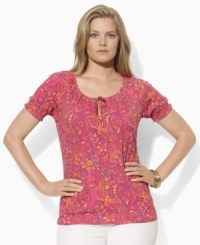 A colorful paisley print lends graphic elegance to this plus size short-sleeved top from Lauren by Ralph Lauren, designed in light-as-air tissue cotton with smocked cuffs and a chic keyhole at the front. A colorful paisley print lends graphic elegance to this plus size short-sleeved top from Lauren by Ralph Lauren, designed in light-as-air tissue cotton with smocked cuffs and a chic keyhole at the front.