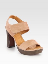Soft suede style with a secure slingback, stacked heel and wide, adjustable straps. Stacked heel, 4 (100mm)Island platform, 1 (25mm)Compares to a 3 heel (75mm)Suede upperLeather lining and solePadded insoleMade in SpainOUR FIT MODEL RECOMMENDS ordering one size up as this style runs small. Soft suede style with a secure slingback, stacked heel and wide, adjustable straps. Stacked heel, 4 (100mm)Island platform, 1 (25mm)Compares to a 3 heel (75mm)Suede upperLeather lining and solePadded insoleMade in SpainOUR FIT MODEL RECOMMENDS ordering one size up as this style runs small.