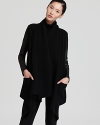 This signature Donna Karan New York cozy is the picture of modernity, rendered in ultra-soft wool and cashmere with supple leather sleeves. Choose it as a chic alternative to a jacket this fall. This signature Donna Karan New York cozy is the picture of modernity, rendered in ultra-soft wool and cashmere with supple leather sleeves. Choose it as a chic alternative to a jacket this fall.