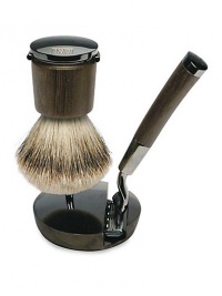 Timeless and elegant, the Acqua di Parma Deluxe Razor and Shaving Brush with Stand brings a touch of Italian craftsmanship to the daily ritual of shaving. The beautiful and functional shaving brush is made of premium hand-selected grey badger hair. The razor's wenge wood handle has been designed with a unique ergonomic shape and weighting system to allow for the easiest and most comfortable shave possible.