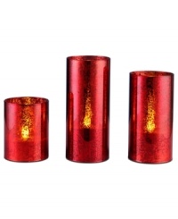 With a beautiful crackled glass construction and bright red hue, this trio of LED pillars makes your home more inviting this holiday season with a festive glow. With a beautiful crackled glass construction and bright red hue, this trio of LED pillars makes your home more inviting this holiday season with a festive glow.
