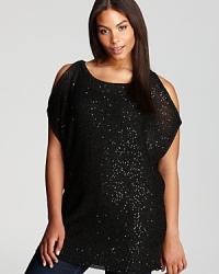 Alluring shoulder cutouts lend provocative spirit to a shimmering DKNYC Plus tunic for an endlessly chic evening choice. If you dare, wear it by day and let the sunlight illuminate your look.