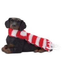 Bark up the right tree with a Christmas ornament for your dog – or a fellow animal lover! A cute black dachshund waits patiently for treats, dressed in a festively striped scarf. From Sandicast. Bark up the right tree with a Christmas ornament for your dog – or a fellow animal lover! A cute black dachshund waits patiently for treats, dressed in a festively striped scarf. From Sandicast.