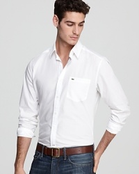 Not your average button-down, this crisp shirt is made from high-quality cotton poplin and boasts Lacoste's signature croc on the left chest pocket. Not your average button-down, this crisp shirt is made from high-quality cotton poplin and boasts Lacoste's signature croc on the left chest pocket.